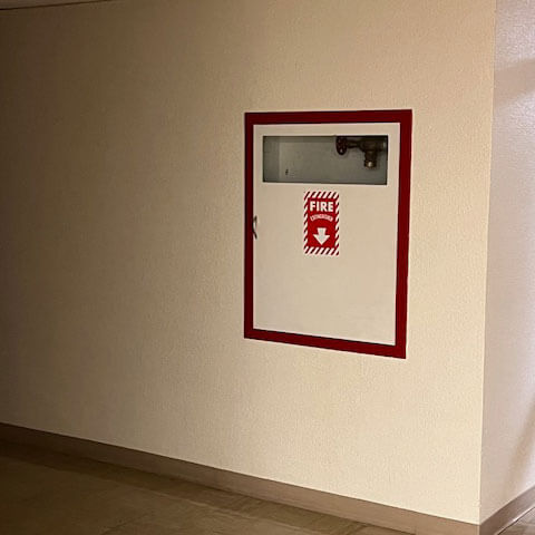 A fire extinguisher with a clear path for access.