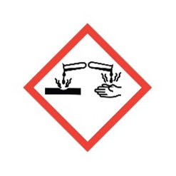 Corrosive material hazard symbol with red border and test tubes.