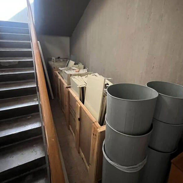 A stairwell being used for storage.